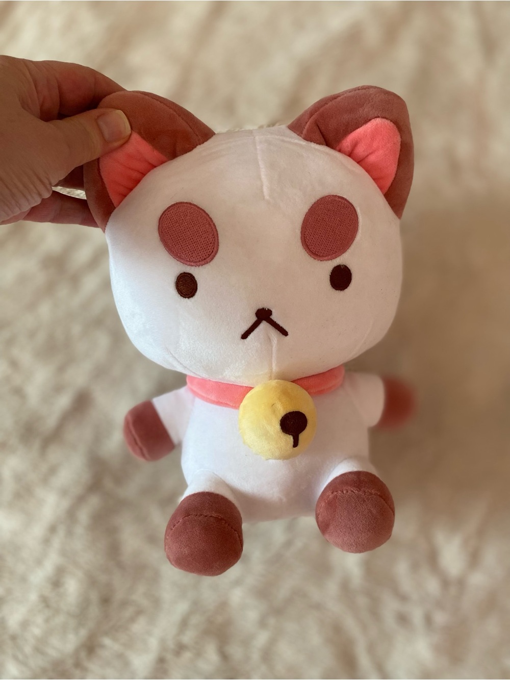 Youtooz Puppycat plush with a collar and bell